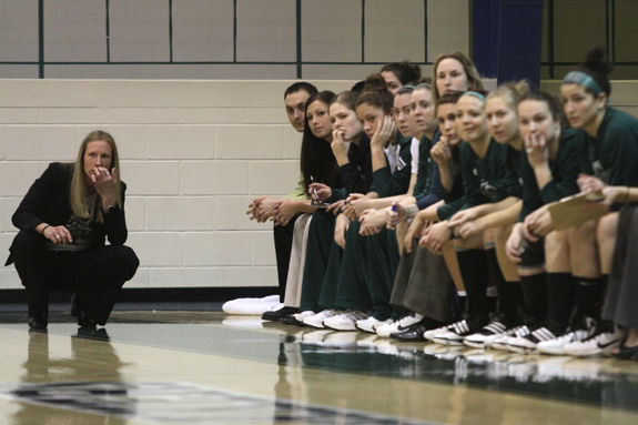 Photo by Ethan Magoc: Mercyhurst College coach Deanna Richard and her players watch the first half action against Clarion University on Wednesday, Jan. 19, 2011, at the Mercyhurst Athletic Center.